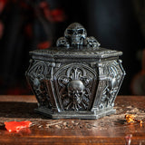 Faux stone grey trinket box with skulls on lid and around the sides