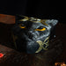 Trinket box shaped like a black cat head, orange eyes and gold triple moon designs.