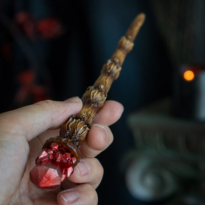 Magic wand with brown skull staff and faux red crystal topper