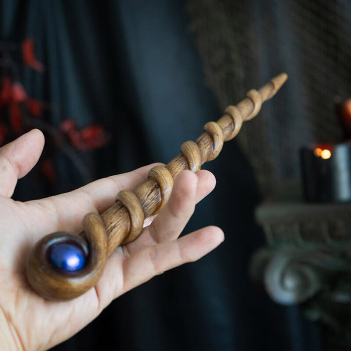 Magic wand with swirling faux-wood staff and blue orb at the top