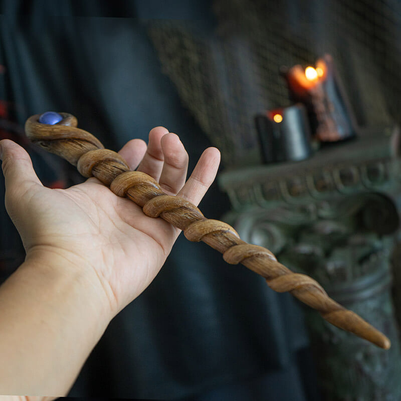 Magic wand with swirling faux-wood staff and blue orb at the top