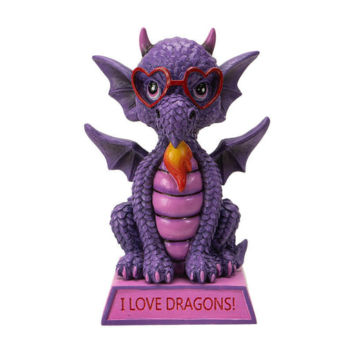 Figurine of a dragon sitting on a pink base that says "I LOVE DRAGONS!" The dragon is purple and pink with red heart glasses and a little burst of fire.