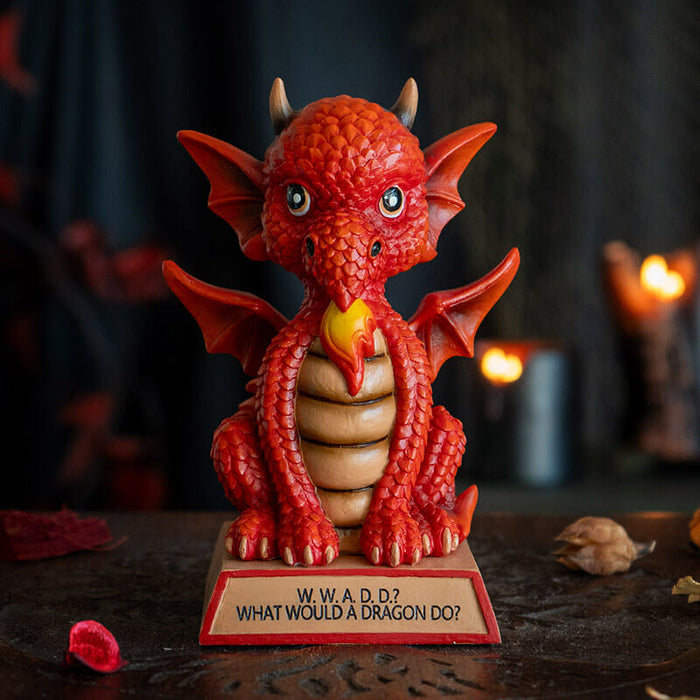 Figurine of a red dragon on a tan base that reads "W.W.A.D.D.? What Would A Dragon Do?" 