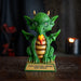 Figurine of a green dragon with flame on tan base that says "Your fantastic dreams have wings!"