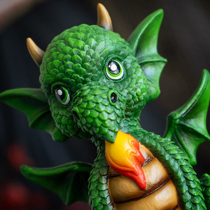 Closeup of green dragon with flame and tan tummy