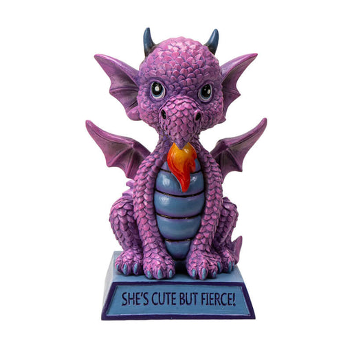 Figurine of a pink dragon with blue tummy and horns and a flame, sitting on indigo base that reads "She's cute but fierce!"