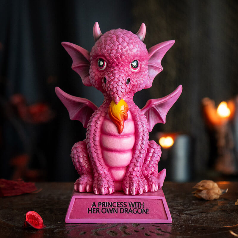 Figurine of pink dragon with fire sitting on base that says "A Princess With Her Own Dragon!"