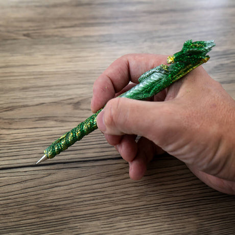 Green dragon pen with gold sparkles