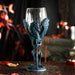 Goblet with glass on top, blue dragon holding a sword forming the stem