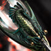 Closeup of green dragon clutching sword hilt