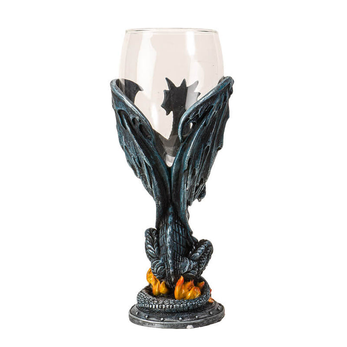 Glass topped goblet with a dragon and flickering flame, holding a sword, forming the stem
