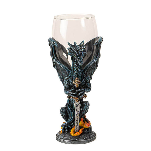 Glass topped goblet with a dragon and flickering flame, holding a sword, forming the stem