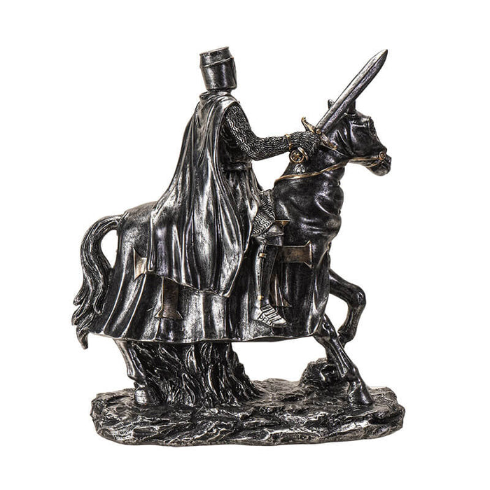 Figurine in faux-metal of knight on horseback with sword and shield, adorned with crosses