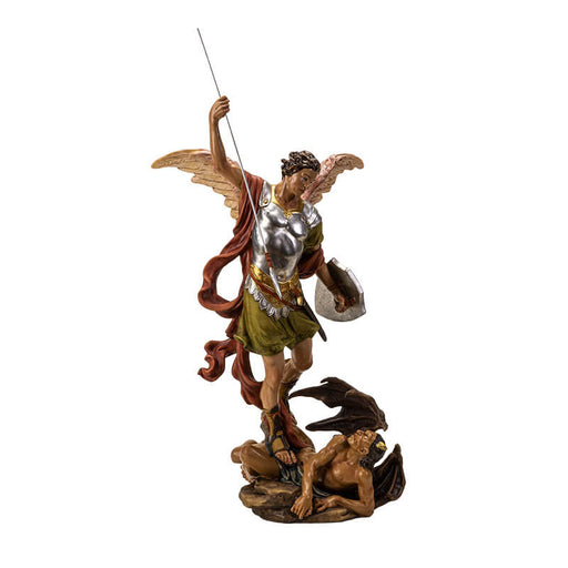 Figurine of angel St. Michael spearing the devil. Angel wears silver armor and has a shield, horned demon is at his feet.