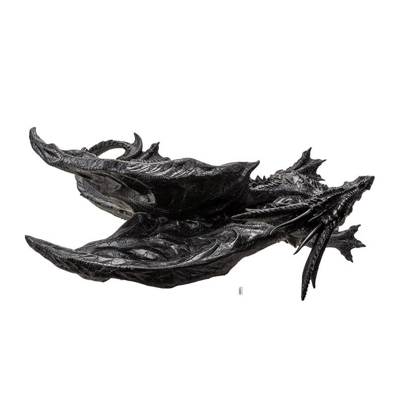 Large black dragon figurine with detailed scales, standing with mouth shut, tail curled. Top down view