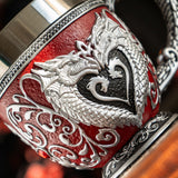 Teacup with stainless steel insert. Dragons in silver forming a heart on red background, swirls and crimson heart jewels.