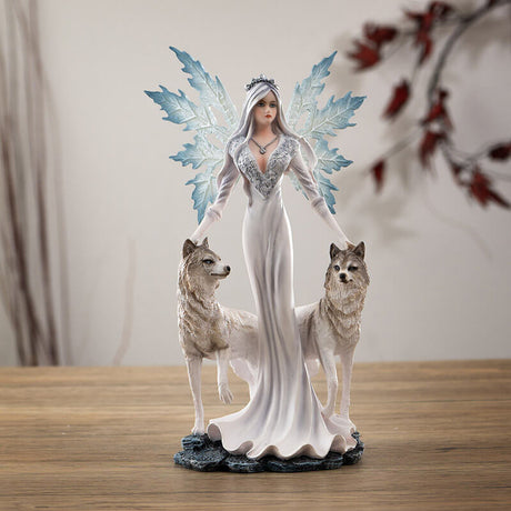 Fairy queen in a white dress with pale hair and blue wings. She stands with two white wolves, a hand on each of their heads. Small size