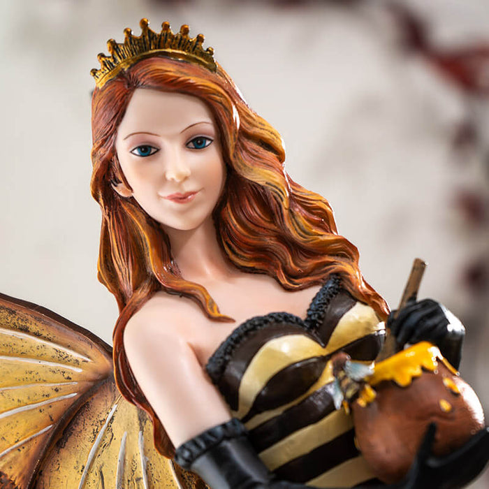 Closeup of fairy with golden crown, red hair, holding honeypot