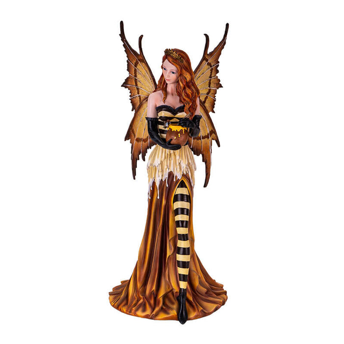 Figurine of fairy in orange, yellow and black with striped stockings and bodice, wearing a crown and holding a honeypot