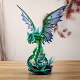 Figurine of green water dragon with emerald and blue wings rising from dark, foamy waves