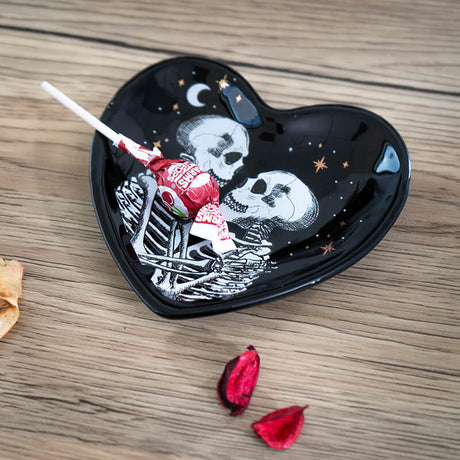 Black ceramic trinket dish with two skeletons, moon and stars