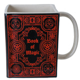 Ceramic mug, white inside and handle, red on black Book of Magic design with arcane symbols