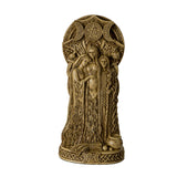 Faux-stone figurine in ivory color with triple goddess - maiden, mother, and crone standing together under a triple moon design - waxing, full and waning. At their feat is a cauldron and sheaf of wheat.