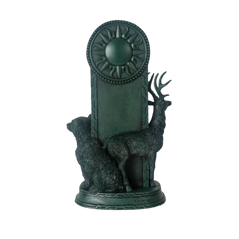 Back of figurine showing sun, bear and stag