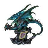 Large green dragon figurine perched on colorful geode rock