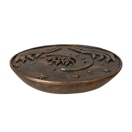 Incense burner in faux bronze with hands framing a crescent moon