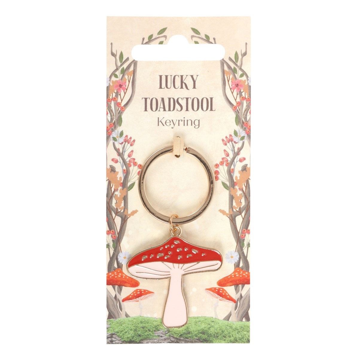 Lucky Toadstool red and white mushroom keychain on forest themed packaging