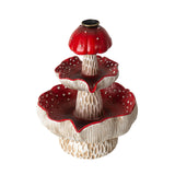 Backflow incense burner featuring three tiered red and white mushroom