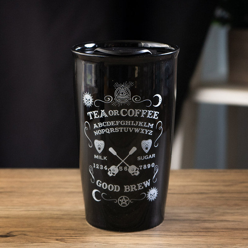 Black travel mug with white text and ouija symbols 