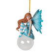 Hanging fairy ornament, blue dress and wings, striped cyan and white stockings, dark blond/light brown hair, perched on glass bubble