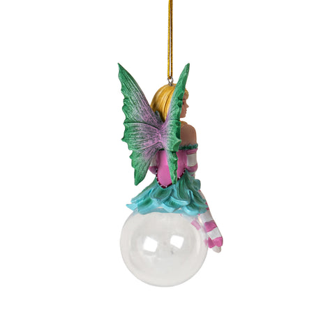 Hanging fairy ornament. Blond, green and pink corset dress, striped sleeves and stockings in pink and white. Green wings with pink. Perched on glass bubble