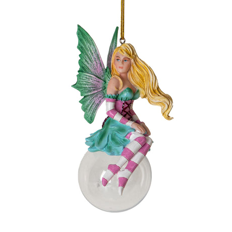 Hanging fairy ornament. Blond, green and pink corset dress, striped sleeves and stockings in pink and white. Green wings with pink. Perched on glass bubble