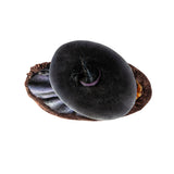 Figurine of a witch in a moody dress and big hat, her hair billowing in an unseen breeze. Next to her is a festive pumpkin, and perched upon it and on her hat are ravens. Shown top down