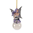Fairy ornament with purple hair and dress, gray wings, black and white striped stockings, perched on glass bubble