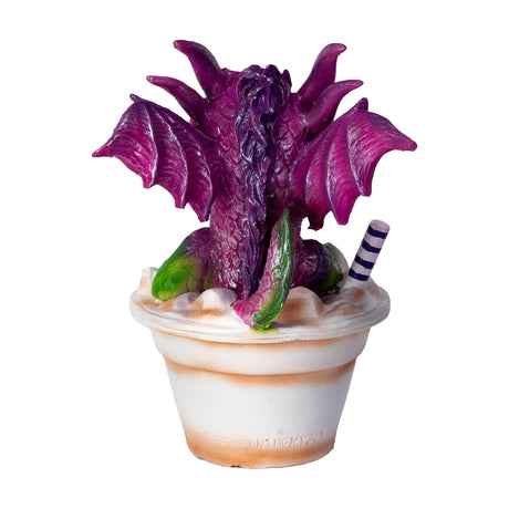 Dragon figurine sitting in an 'Iced Coffee' cup with a straw, shown from the back