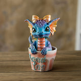Colorful blue and orange dragon figurine in a glass labeled 'Iced Tea' 