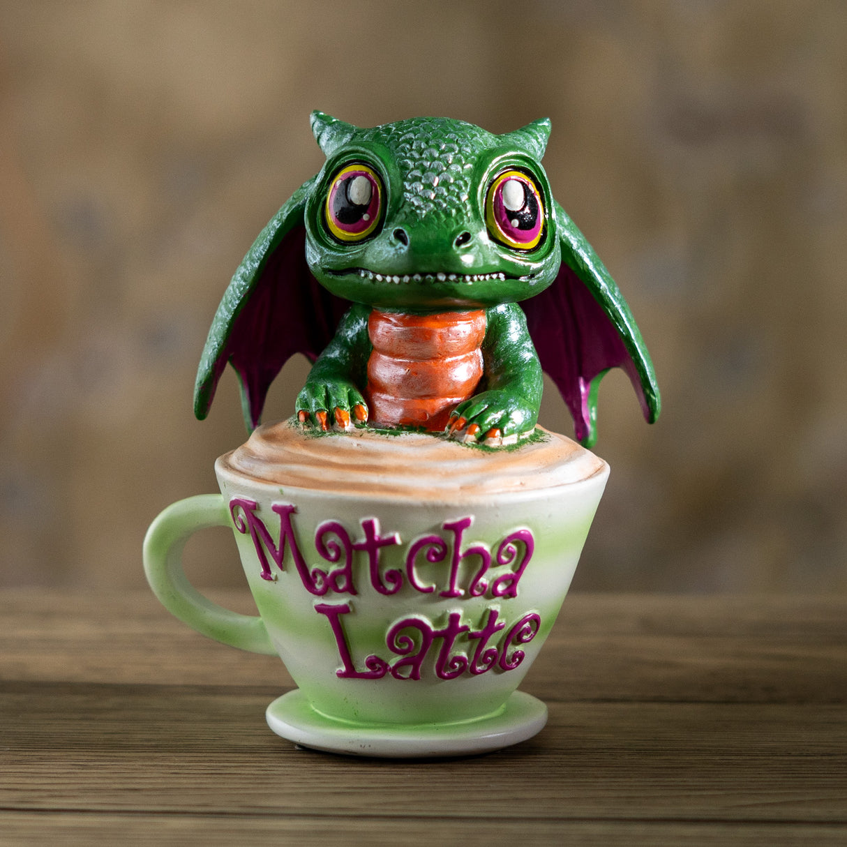 Green dragon figurine on a 'Matcha Latte' cup 