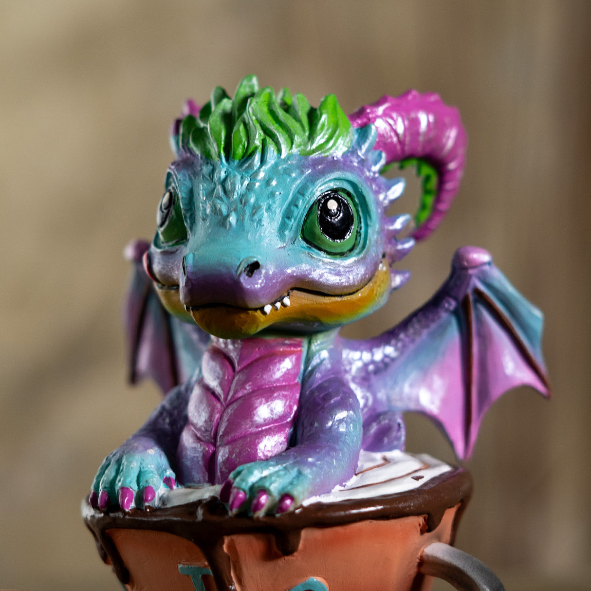 Colorful dragon figurine in a cup 