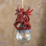 Red dragon ornament on rocks on a glass orb bubble