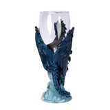 Glass goblet with blue dragon holding sword with white wolf, shown from the back