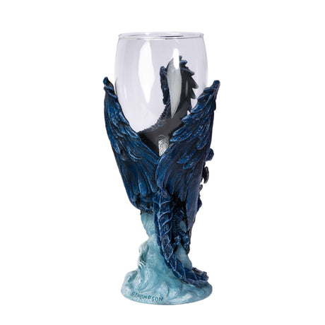 Glass goblet with blue dragon holding sword with white wolf, shown from the back