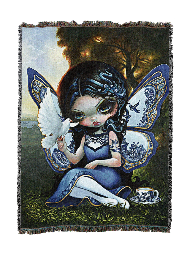 Fairy with butterfly wings holding a dove on a woven blanket