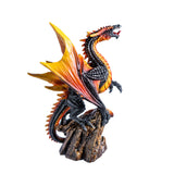 Dragon figurine with fiery orange and black colors, perched on a rock