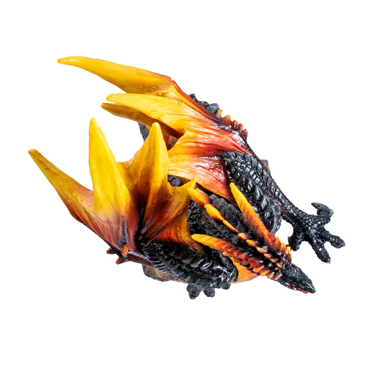 Dragon figurine with fiery orange and black colors, perched on a rock, shown top down