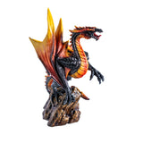 Dragon figurine with fiery orange and black colors, perched on a rock