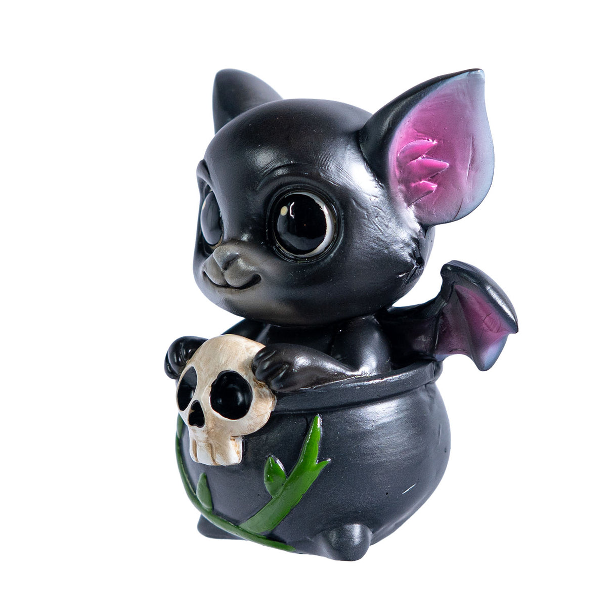Small figurine of a black dragon imp with pink accents sitting in a cauldron with vines and a skull